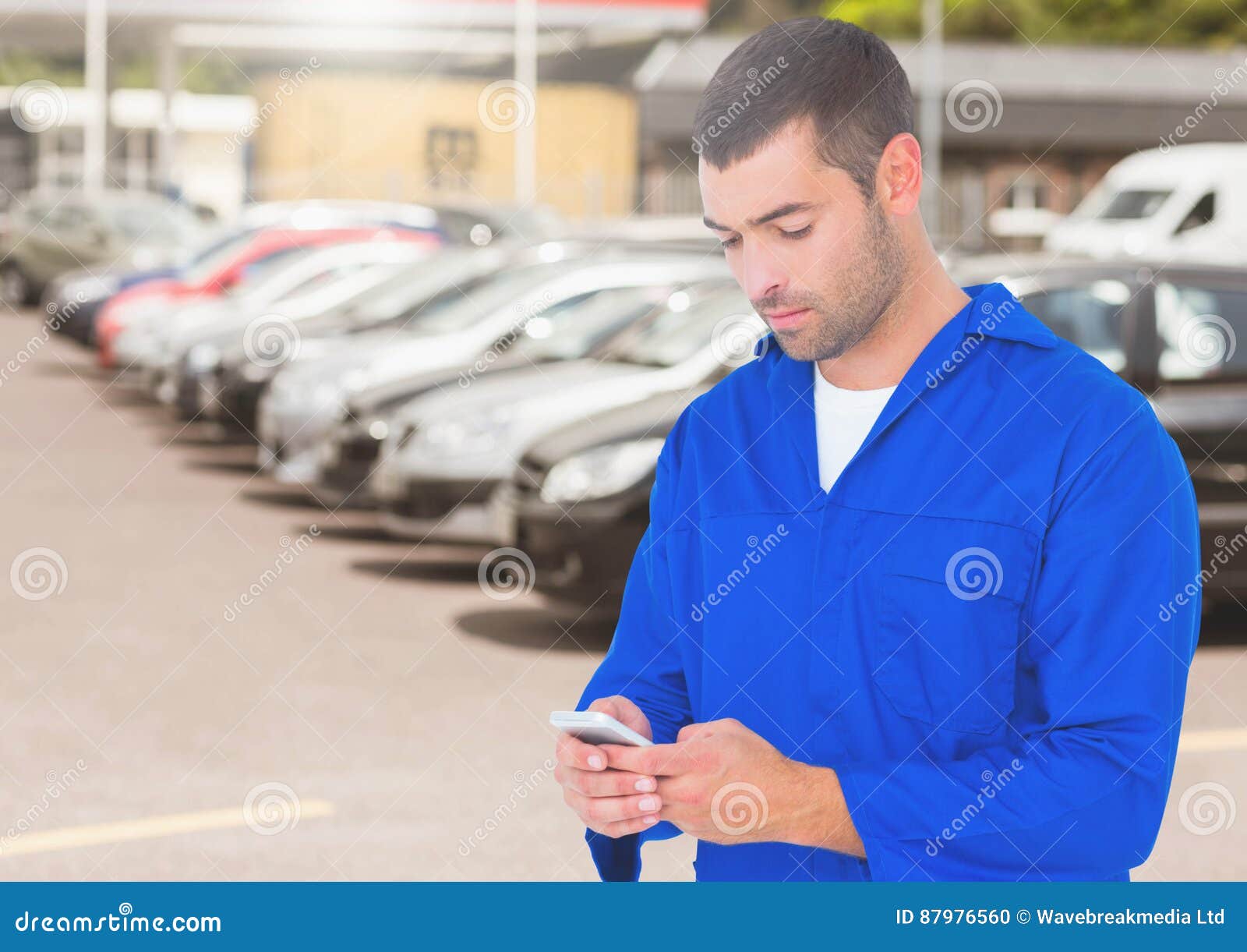 Automobile Mechanic Using Mobile Phone Stock Photo Image of dealership, male 87976560
