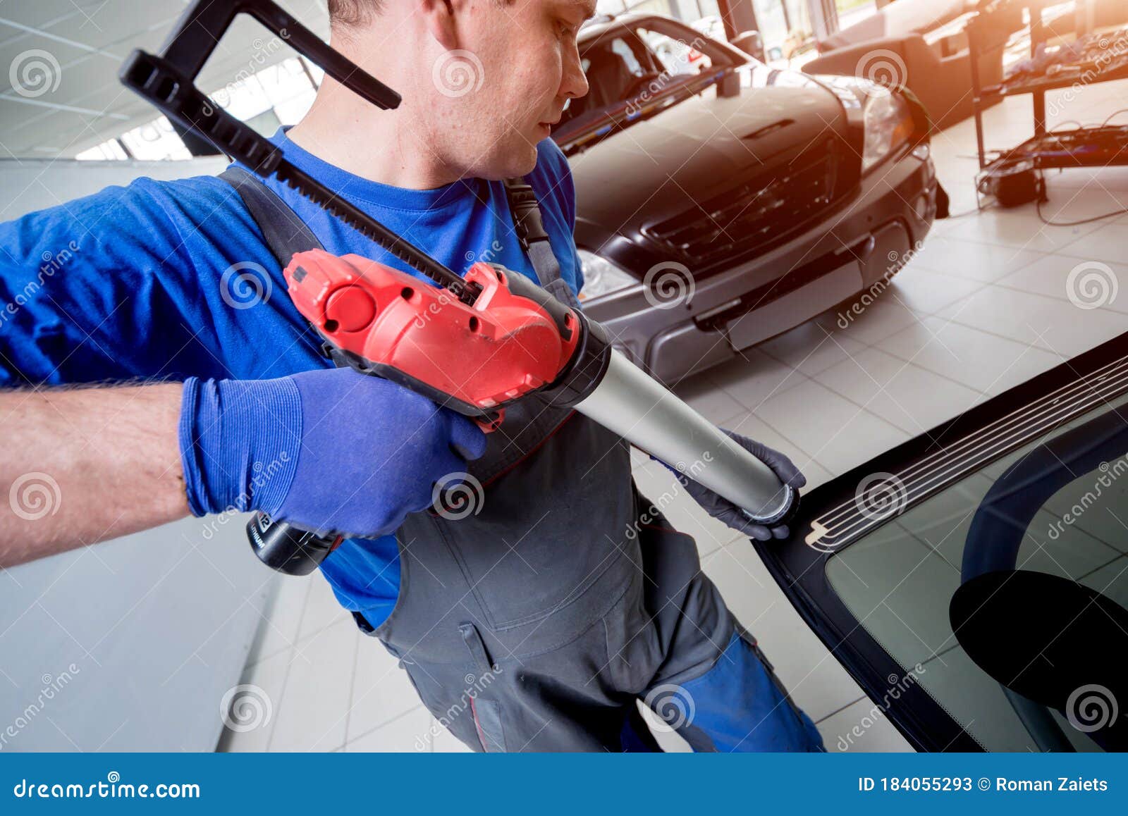 Automobile Special Workers Replacing Windscreen of a Car in Auto