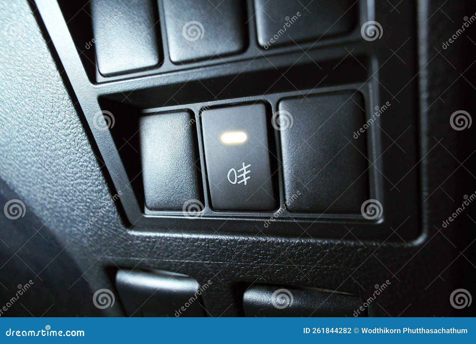 Automotive Spotlight Button Switch on Dashboard in the Car Stock Photo
