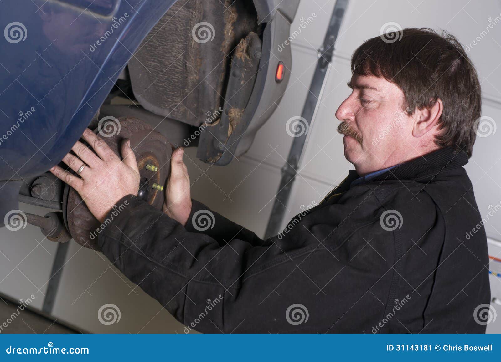 Automotive Technician Manually Pulls Rotor Checking Brakes Auto Stock