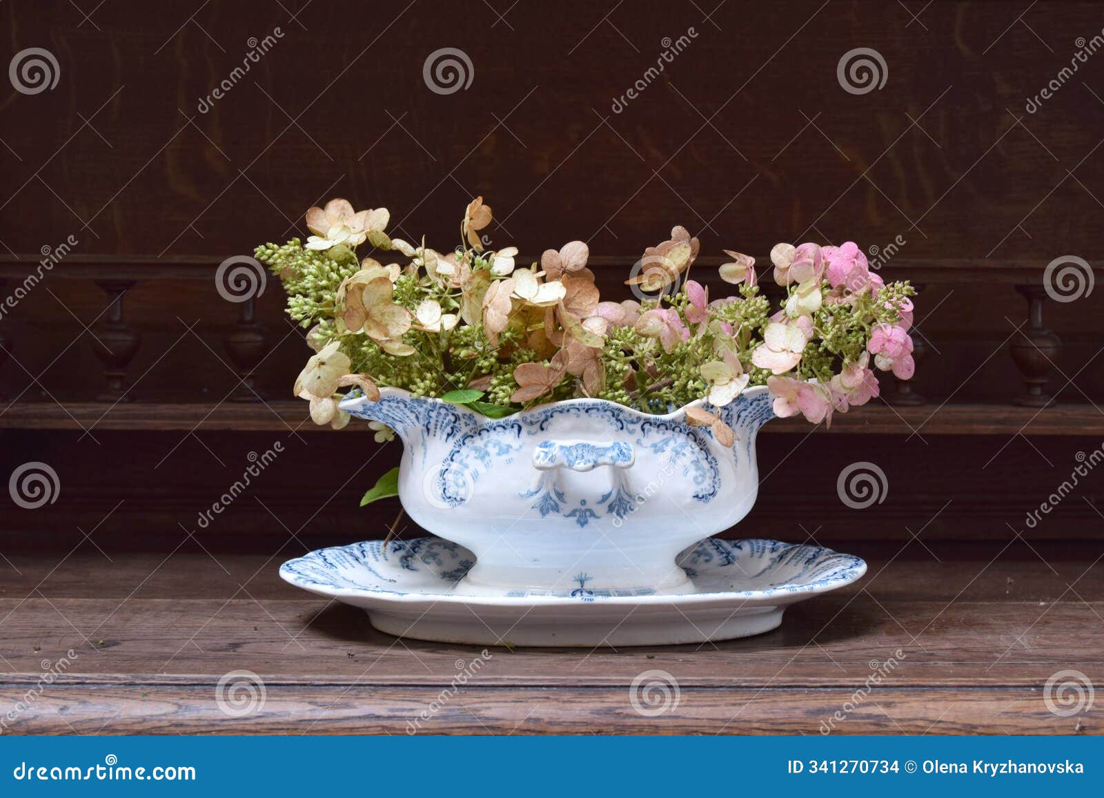 autumn composition of flowers in vintage sauceboat