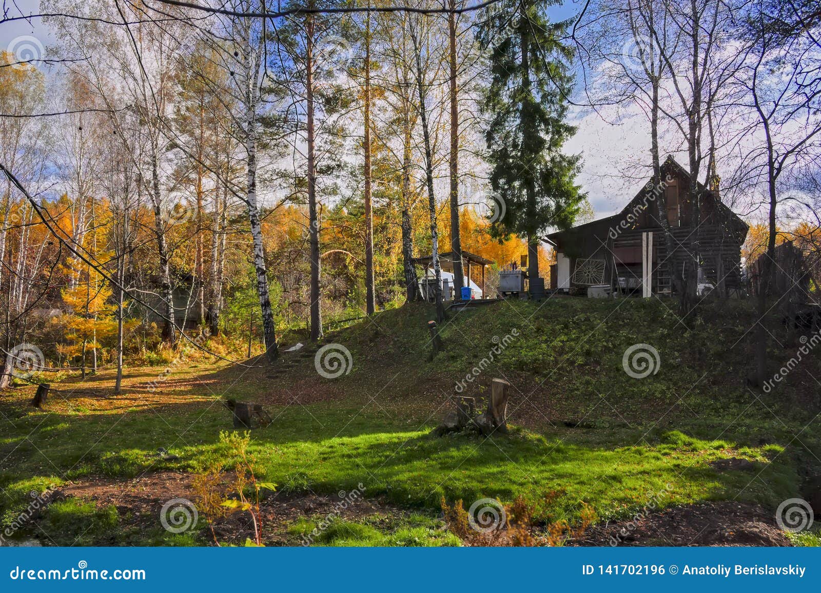 Autumn Landscape with Small Rural River at the Edge of the Village