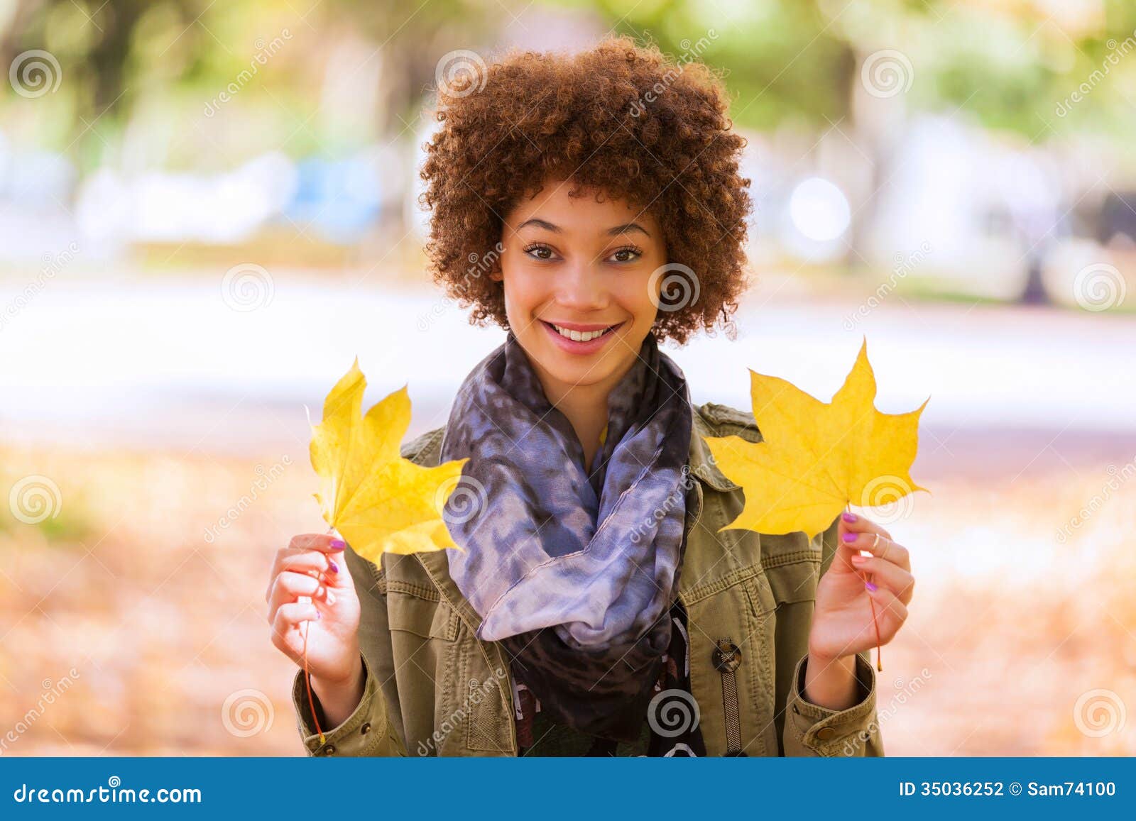 Autumn Outdoor Portrait Of Beautiful African American Young Woman Holding Yellow Leaves Black