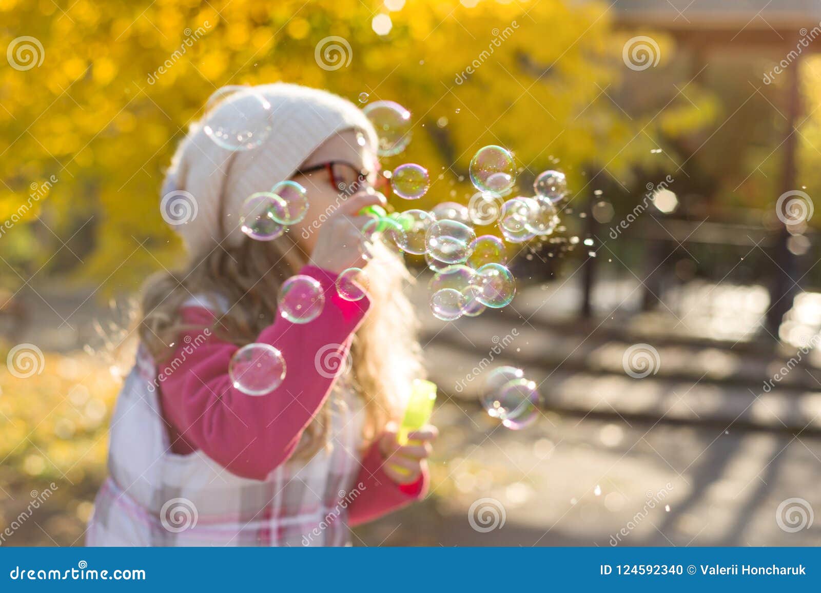 Autumn Portrait Of A Child Girl With Soap Bubbles ...