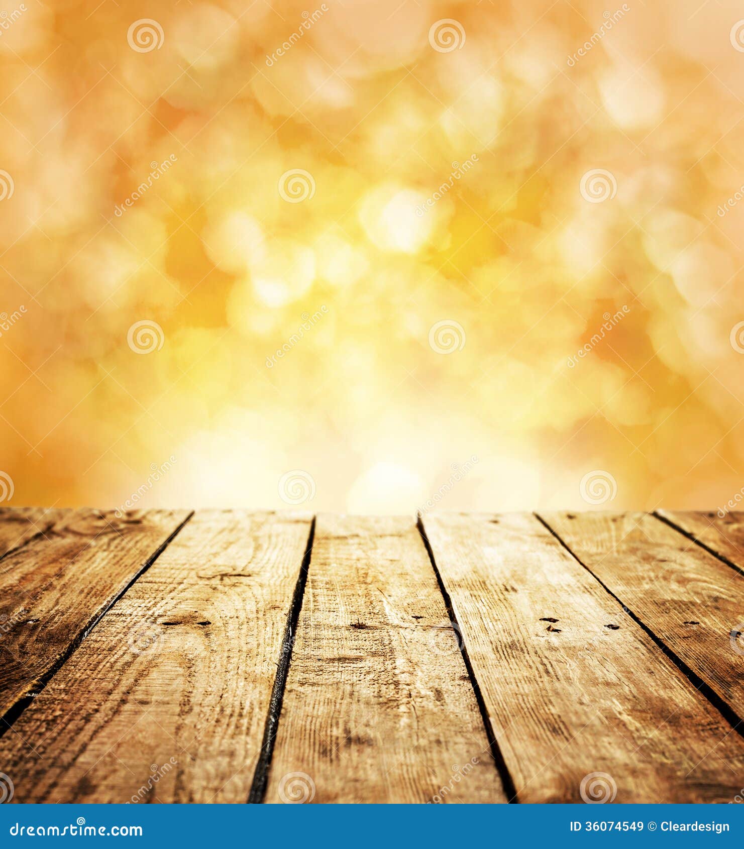 table in perspective on warm orange abstract bokeh - outdoor in the