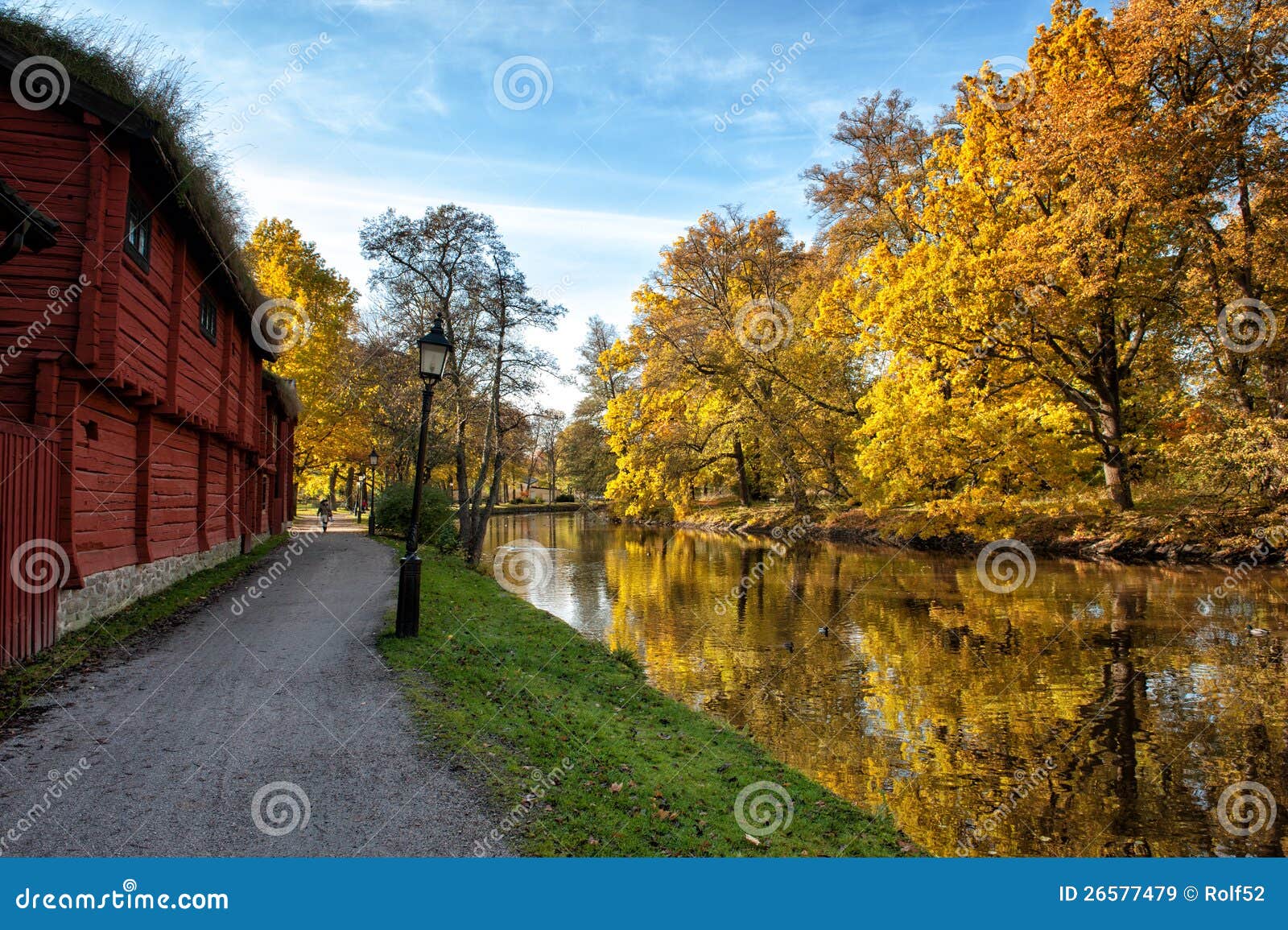 Autumn in Scandinavia. Orebro, Sweden - October 21, 2011: A sunny October day at Wadkoping open-air museum in Orebro, Sweden. The museum has a collection of old historic traditional Swedish homes and buildings.