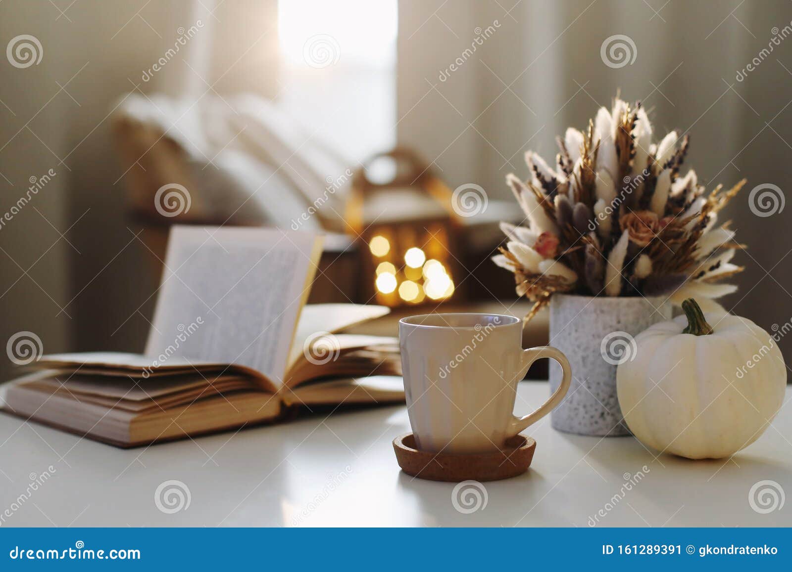 autumn still life. coffee cup, flowers, book and pumpkin. hygge lifestyle, cozy autumn mood. flat lay, happy thanksgiving