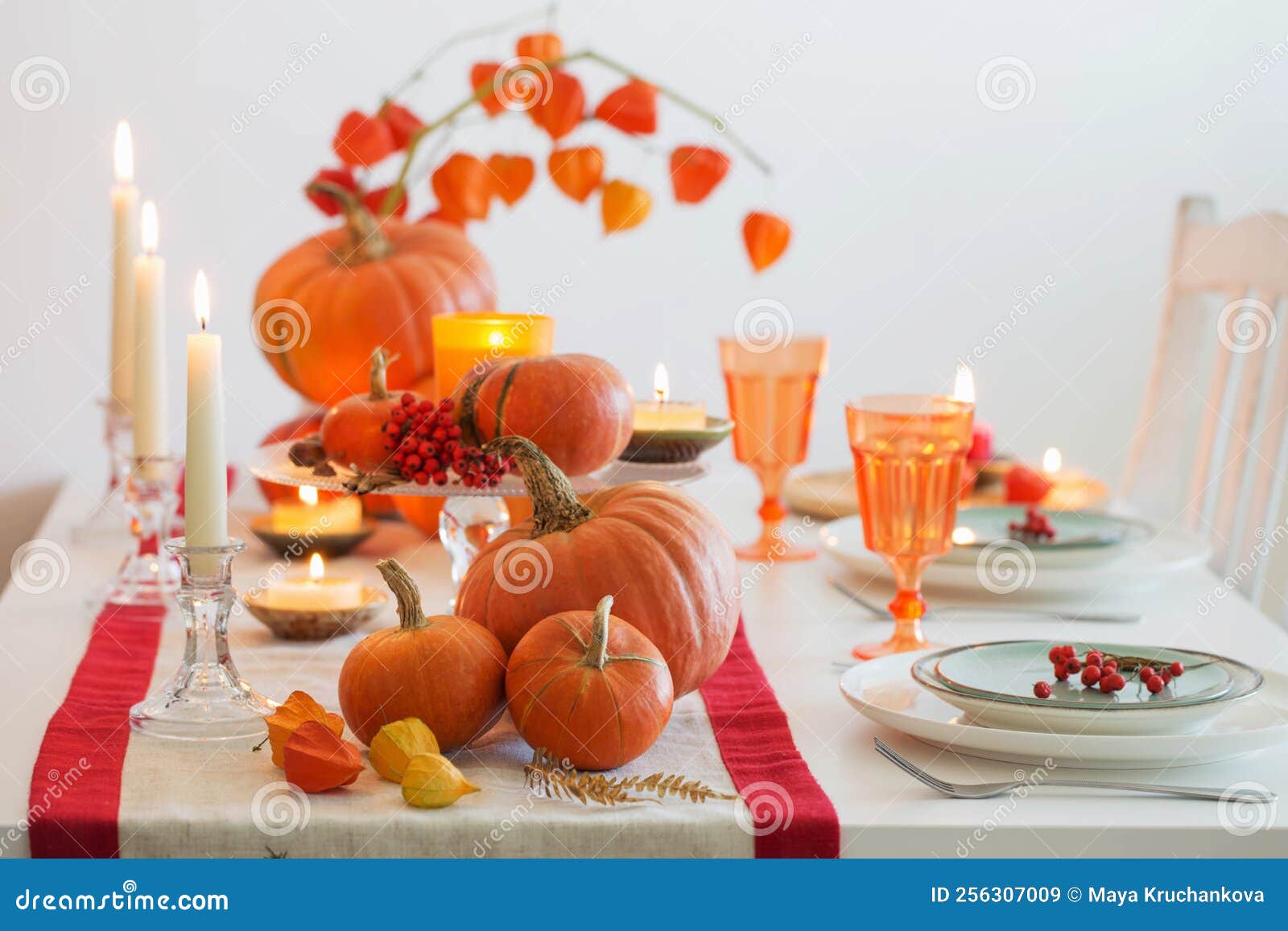 Autumn Table Setting with Burning Candles and Pumpkins Stock Image