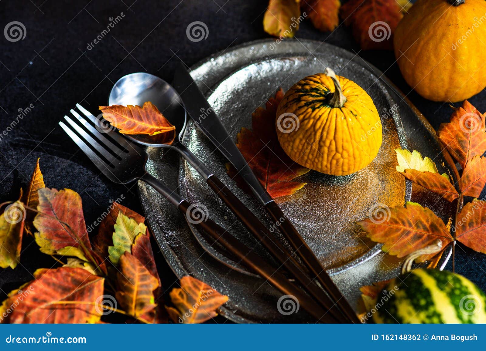 Autumnal table setting stock photo. Image of silverware - 162148362