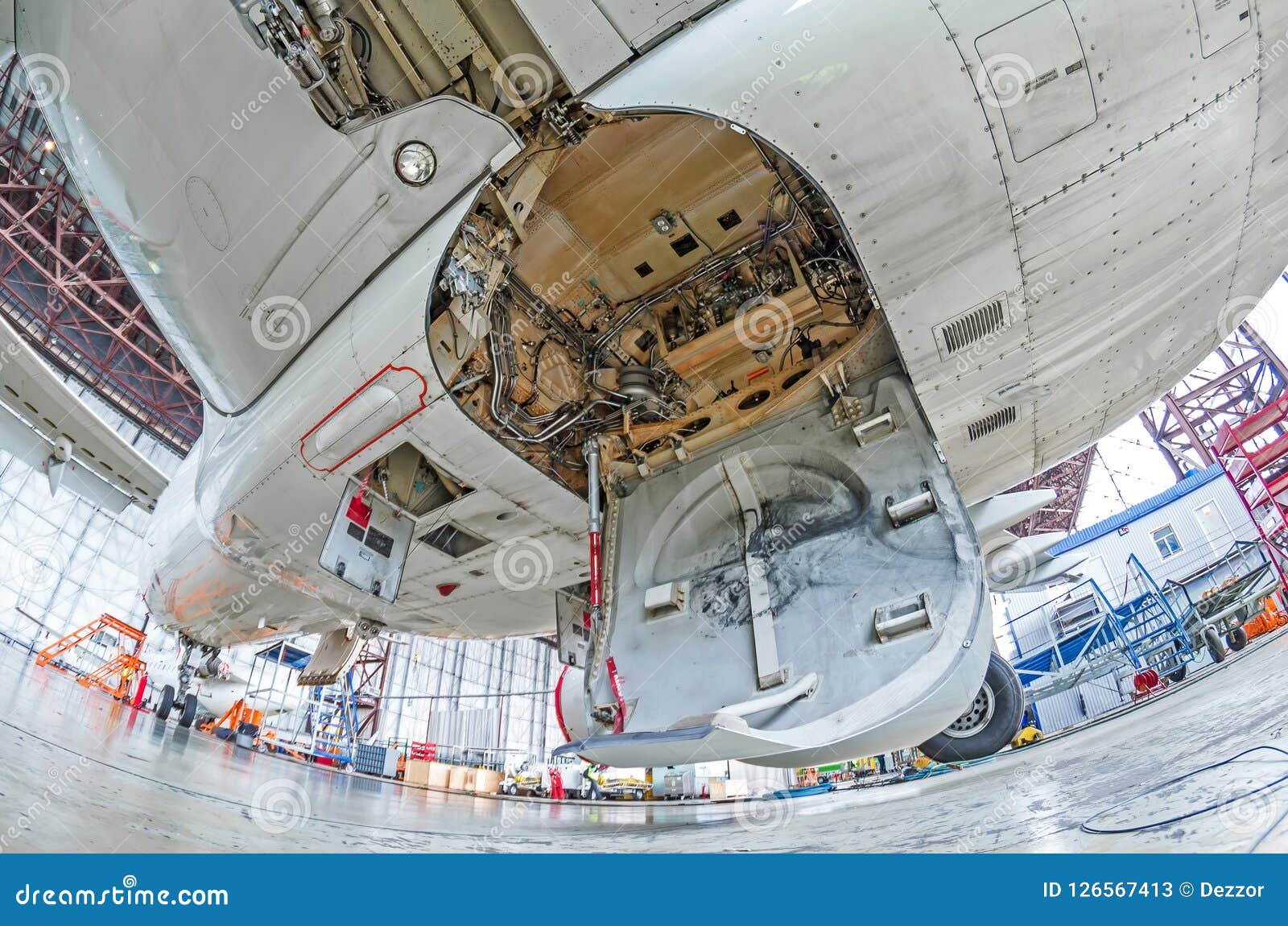 aviation hangar with airplane, close-up landing gear of the airplane landing gear on maintenance repair.