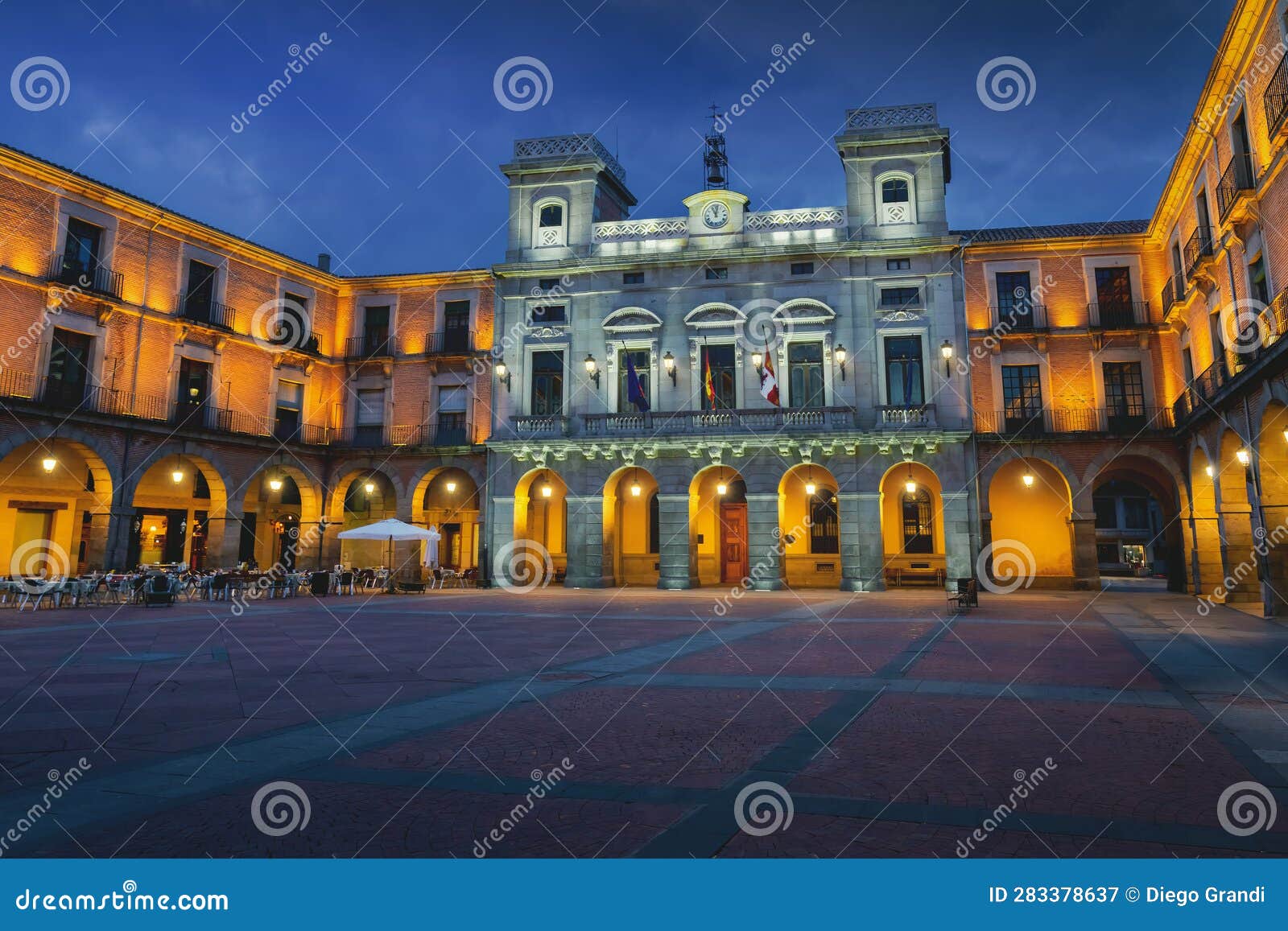 avila town hall at plaza del mercado chico square at night - avila, spain