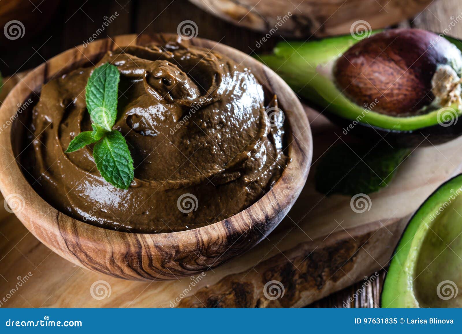 avocado chocolate mousse in olive wooden bowl