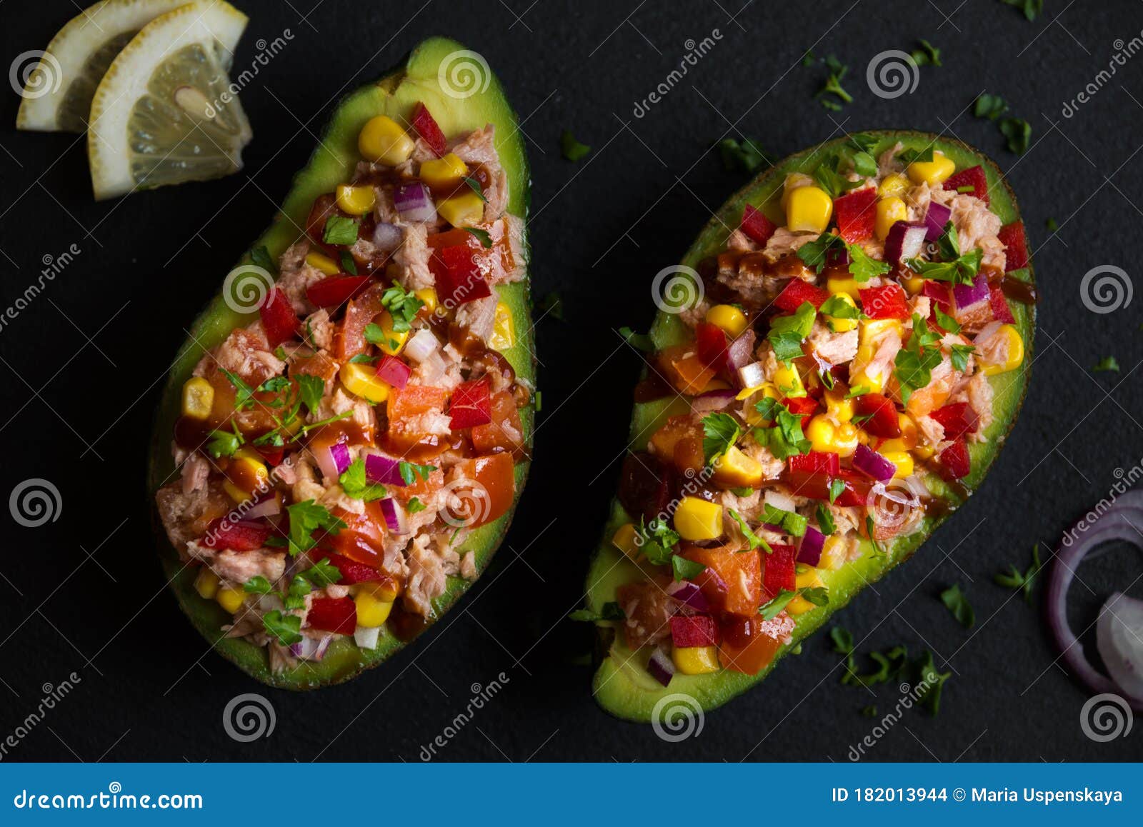 Avocado Halves Stuffed with Tuna Fish and Vegetables Stock Photo