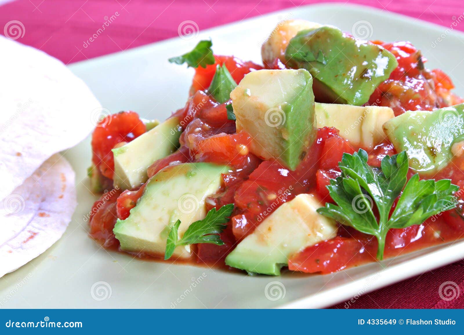 avocado over pico de gallo salsa sauce