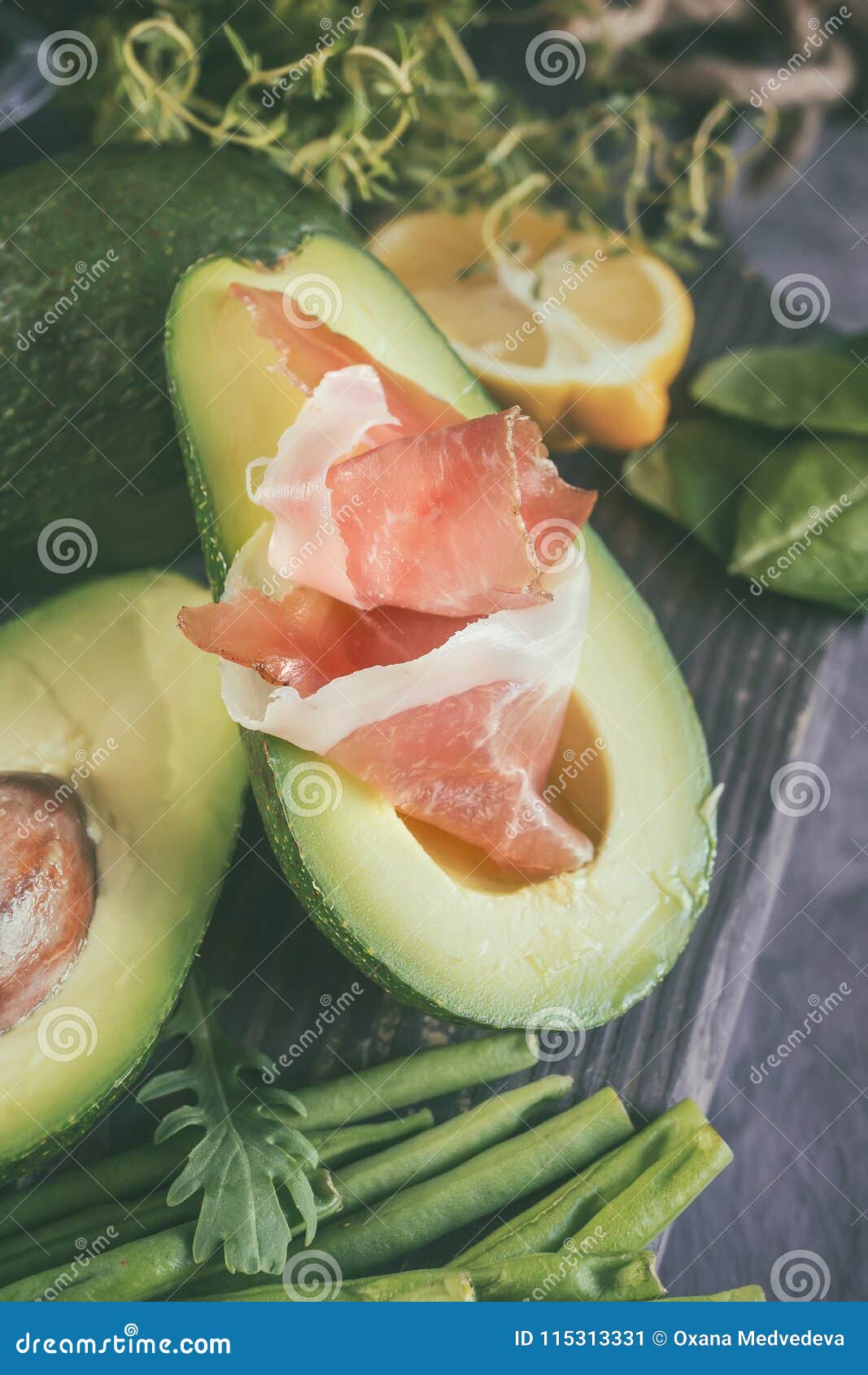 avocado and prosciutto for making toast for breakfast. the vertical frame