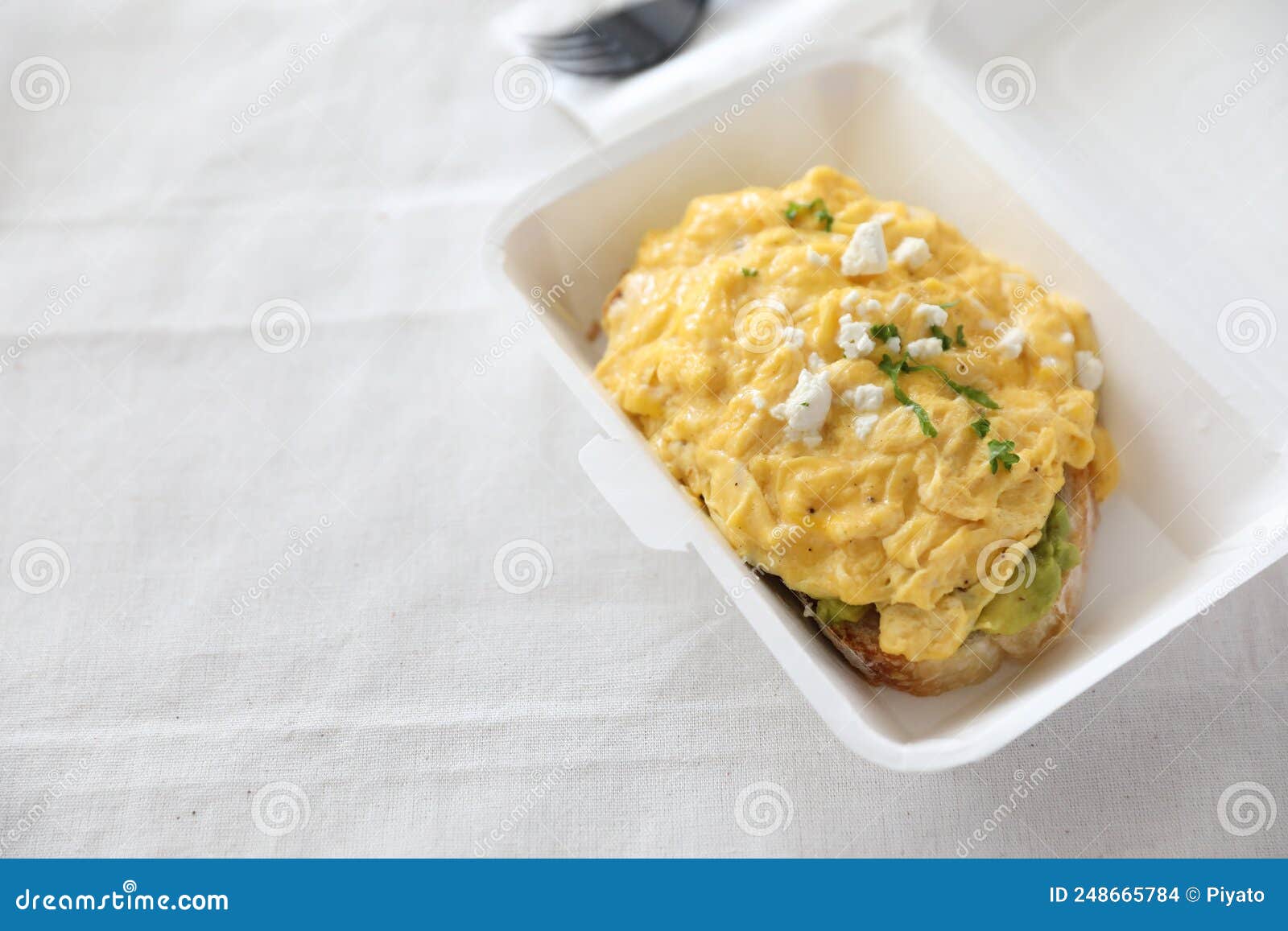 Avocado and Scrambled Eggs Toast with Delivery Package in White