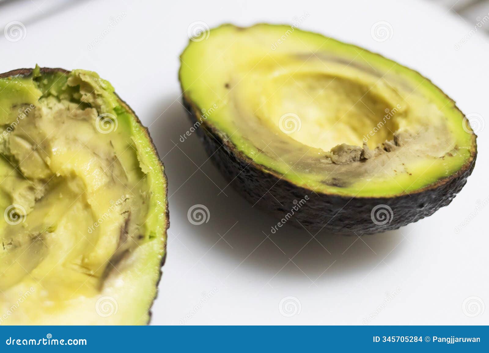 avocados are rotten if they're mushy when squeezed, brown or moldy inside, and have developed rancidity or a sour smell
