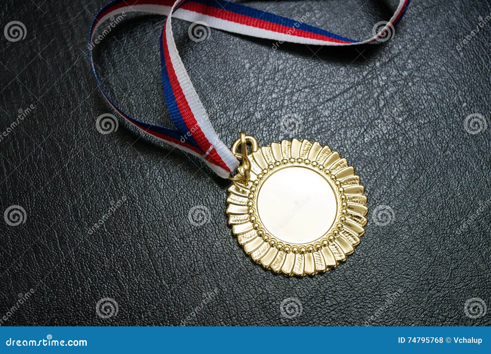 award for a winner - gold medal on black background