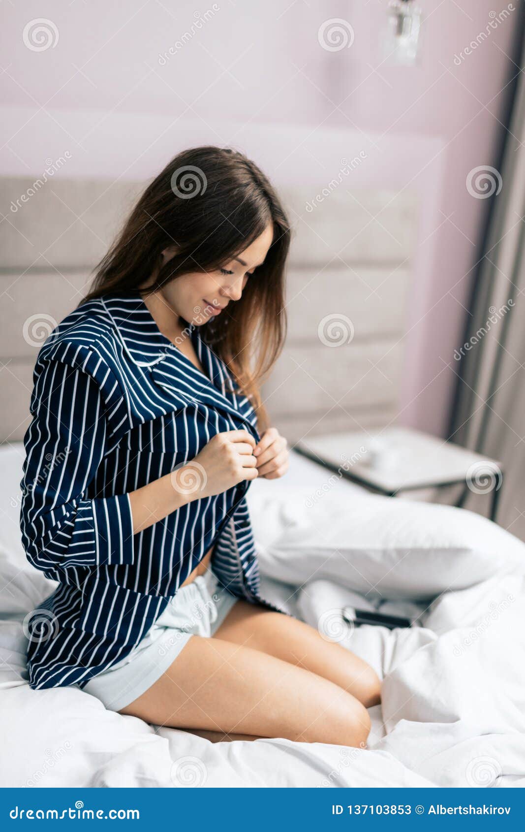 Woman Taking Off Shirt Bed Stock Photos - Free & Royalty-Free