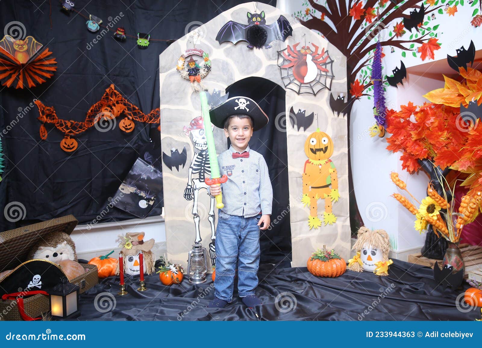 A child poses for photos next to the Pumpkin sculptures by