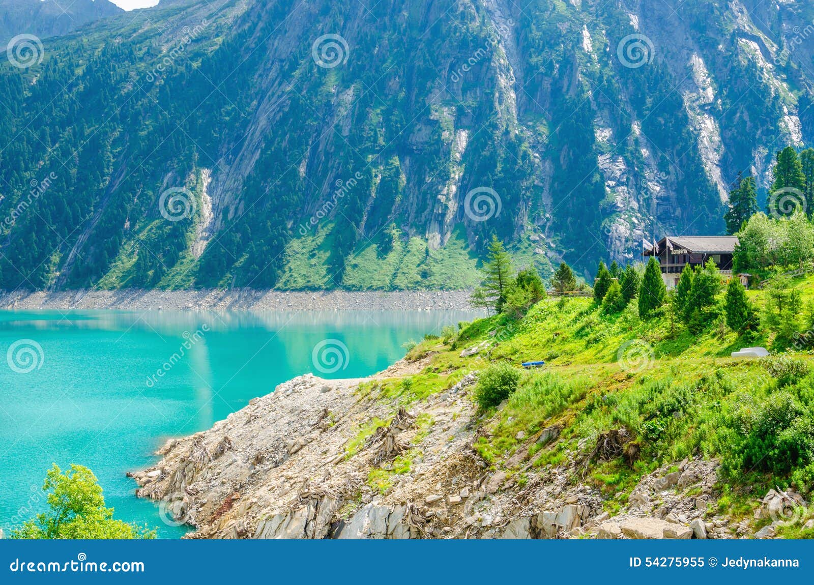 azure lakem wooden hut and peaks of alps, austria
