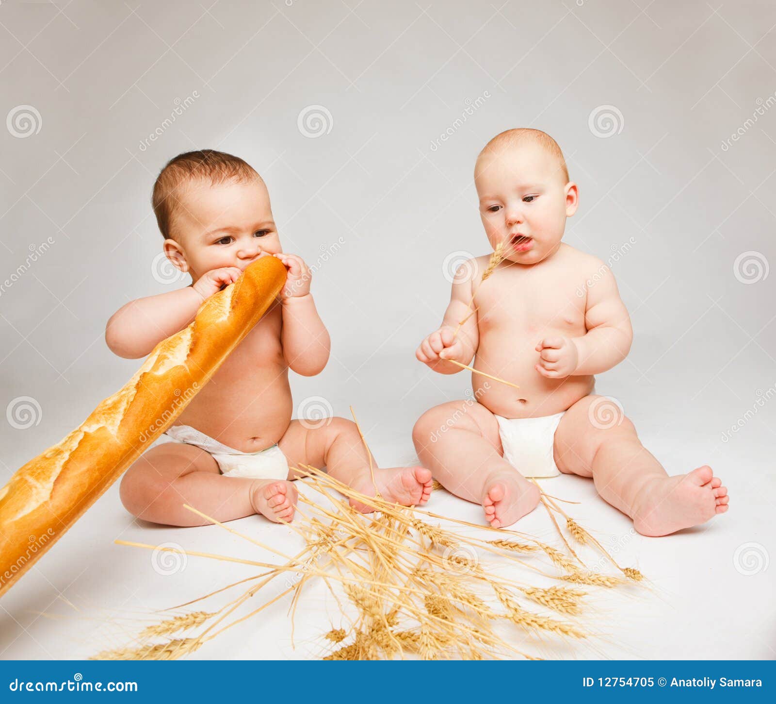 Babies with bread stock image. Image of hold, health 12754705