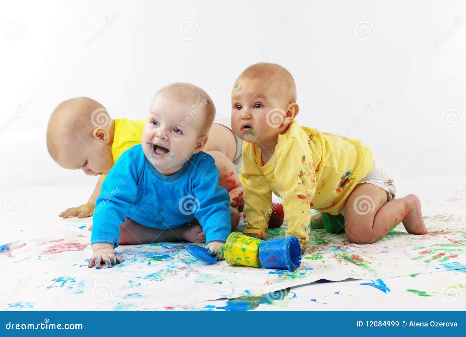 Babies painting stock image. Image of colorful, elementary 12084999
