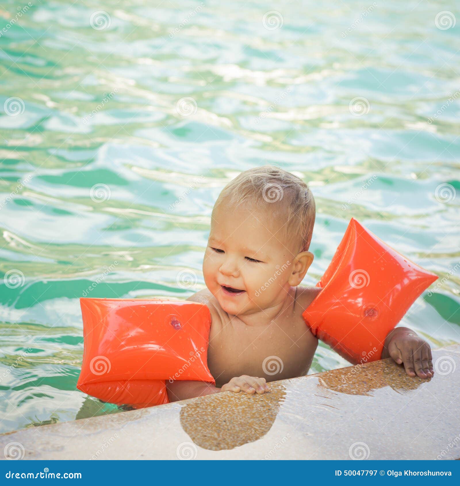 Baby with armbands stock image. Image of baby, pool, sport 50047797