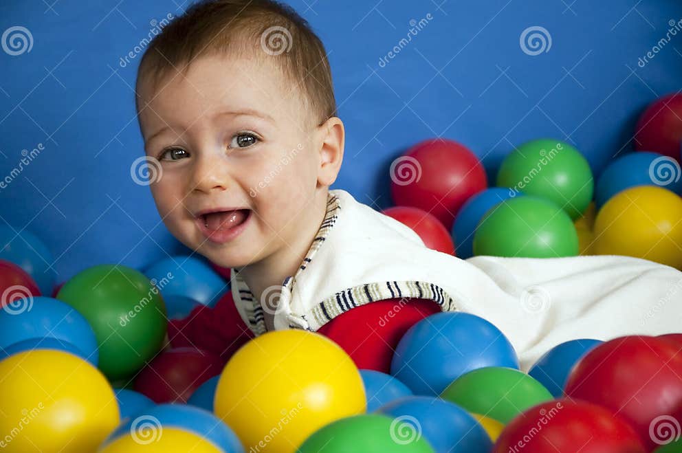Baby with balls stock photo. Image of colour, colours 11276170