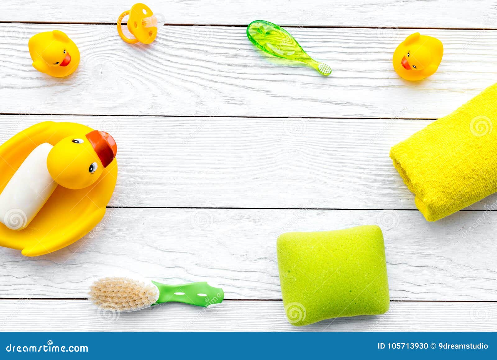 Baby Bath Set With Yellow Rubber Duck Soap Sponge Brushes Towel On White Wooden Background Top View Copyspace Stock Photo Image Of Baby Hygiene 105713930