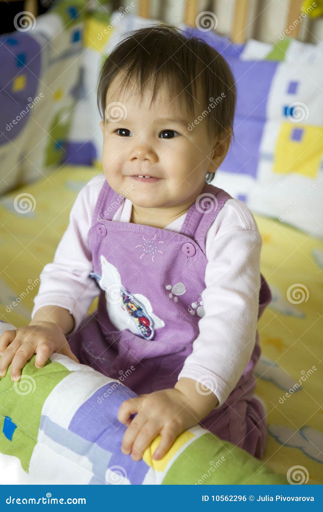 Baby in bed stock photo. Image of people, innocence, brown 10562296