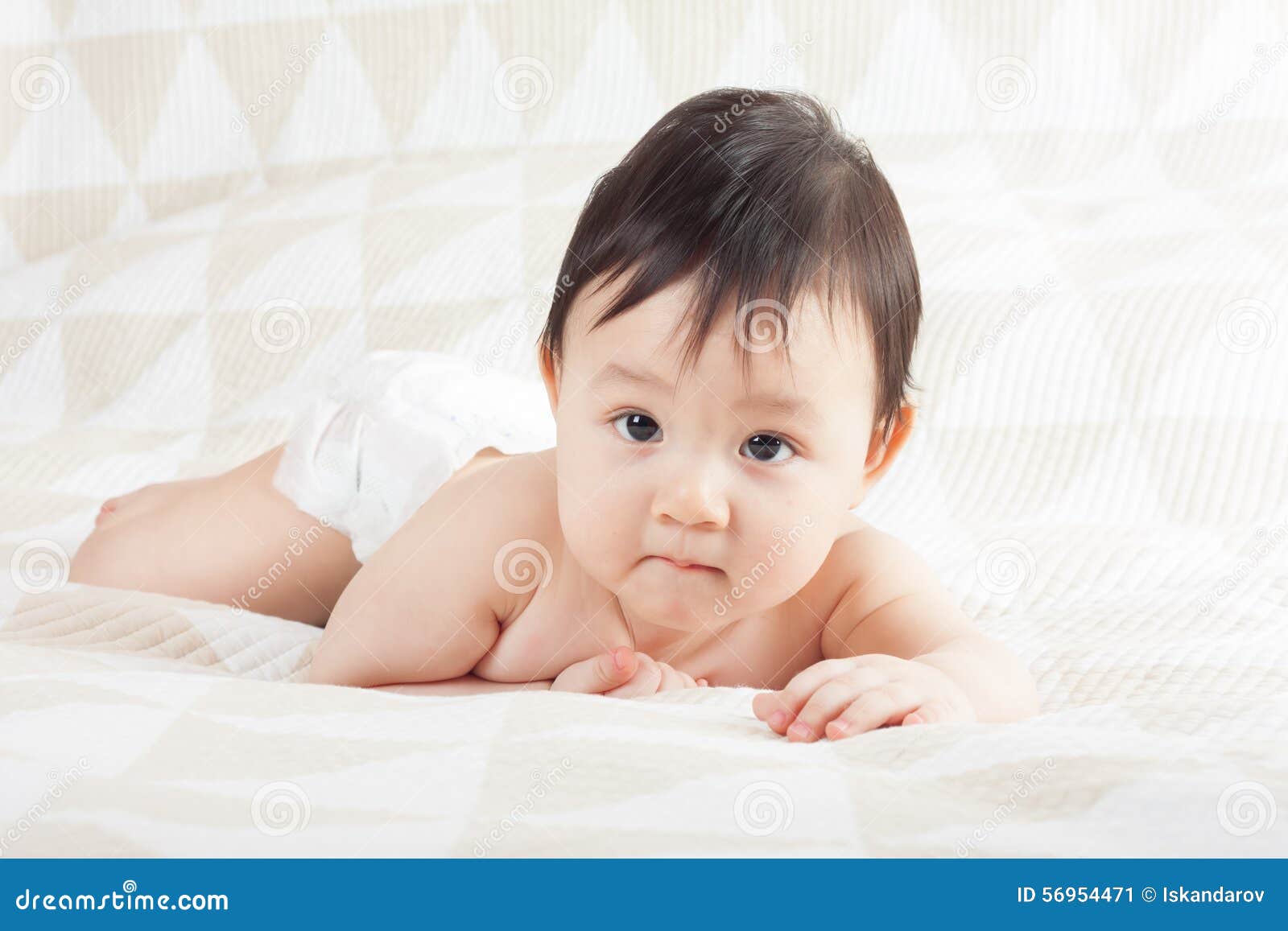 Baby on the bed stock image. Image of laughing, lifestyles 56954471