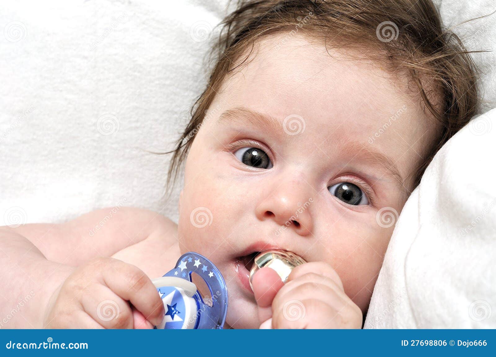 Baby in Bed with Dummy and Silver Toy Stock Photo Image of life