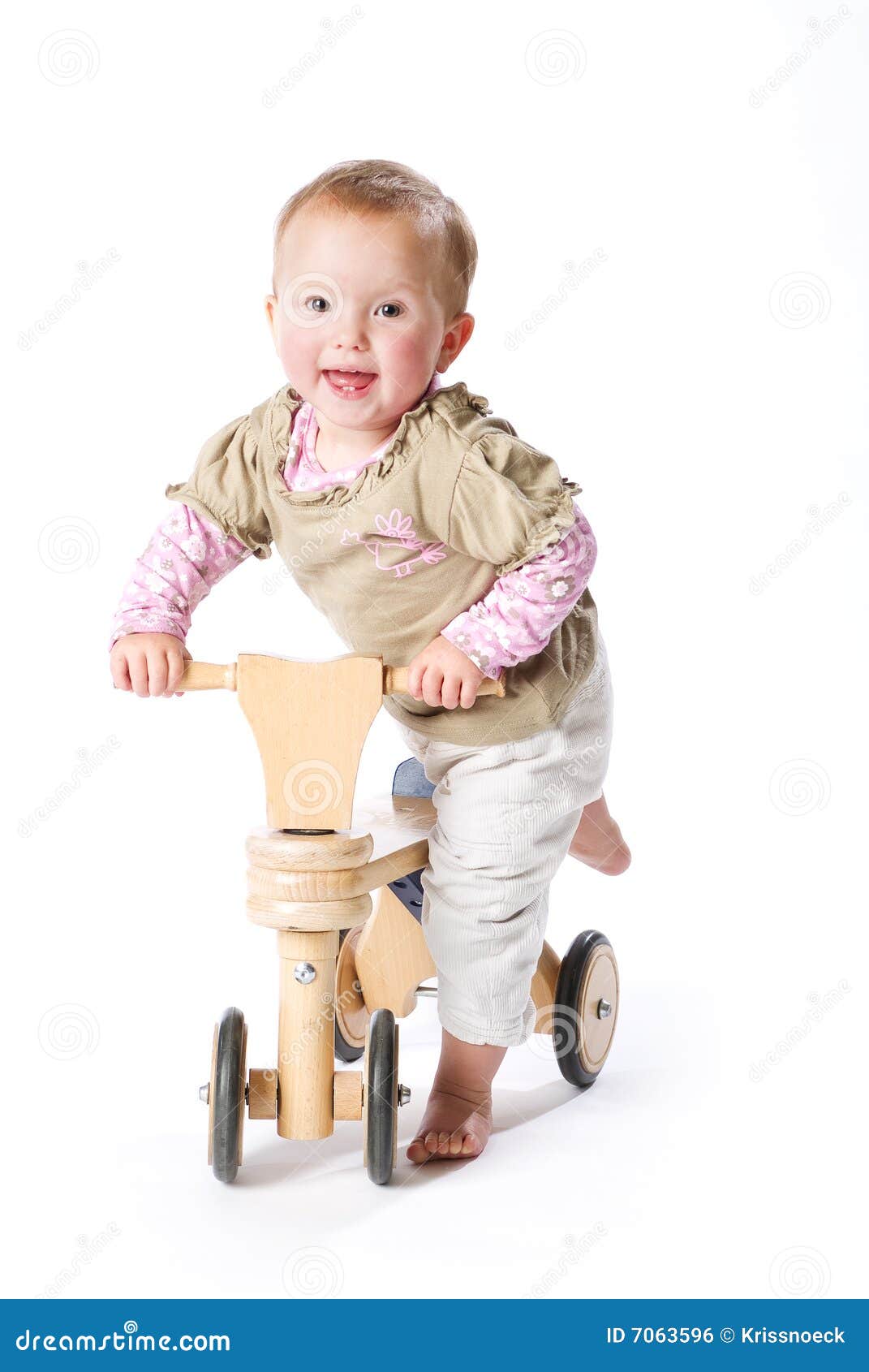 Baby on bicycle stock photo. Image of background, wood 7063596