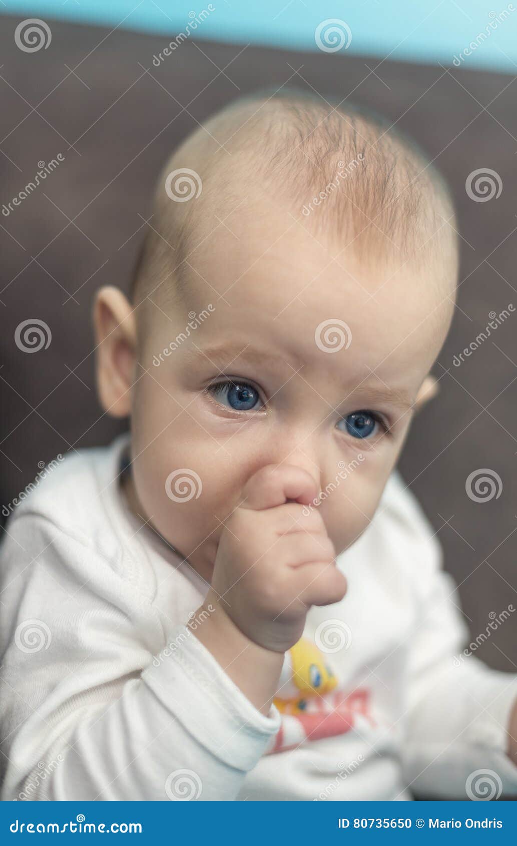 Baby with blue eyes stock photo. Image of floor, beautiful 80735650