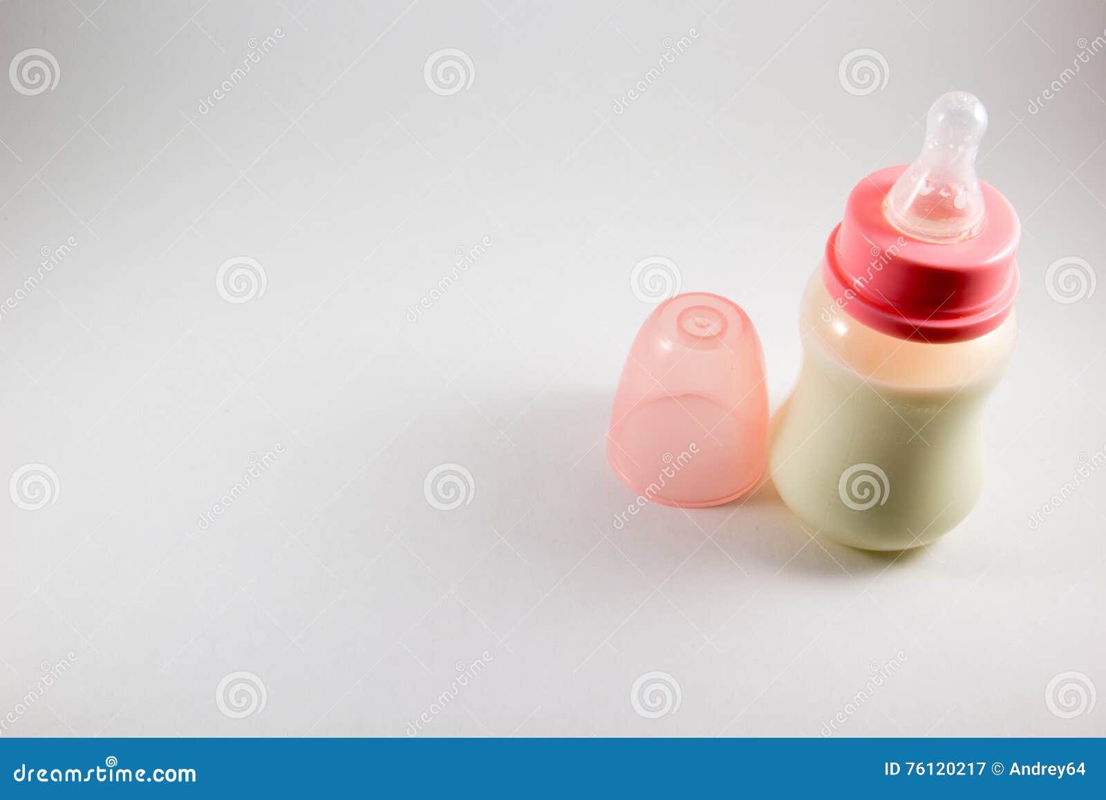 Baby Bottle with Milk and Pacifier on a White Background Stock Image
