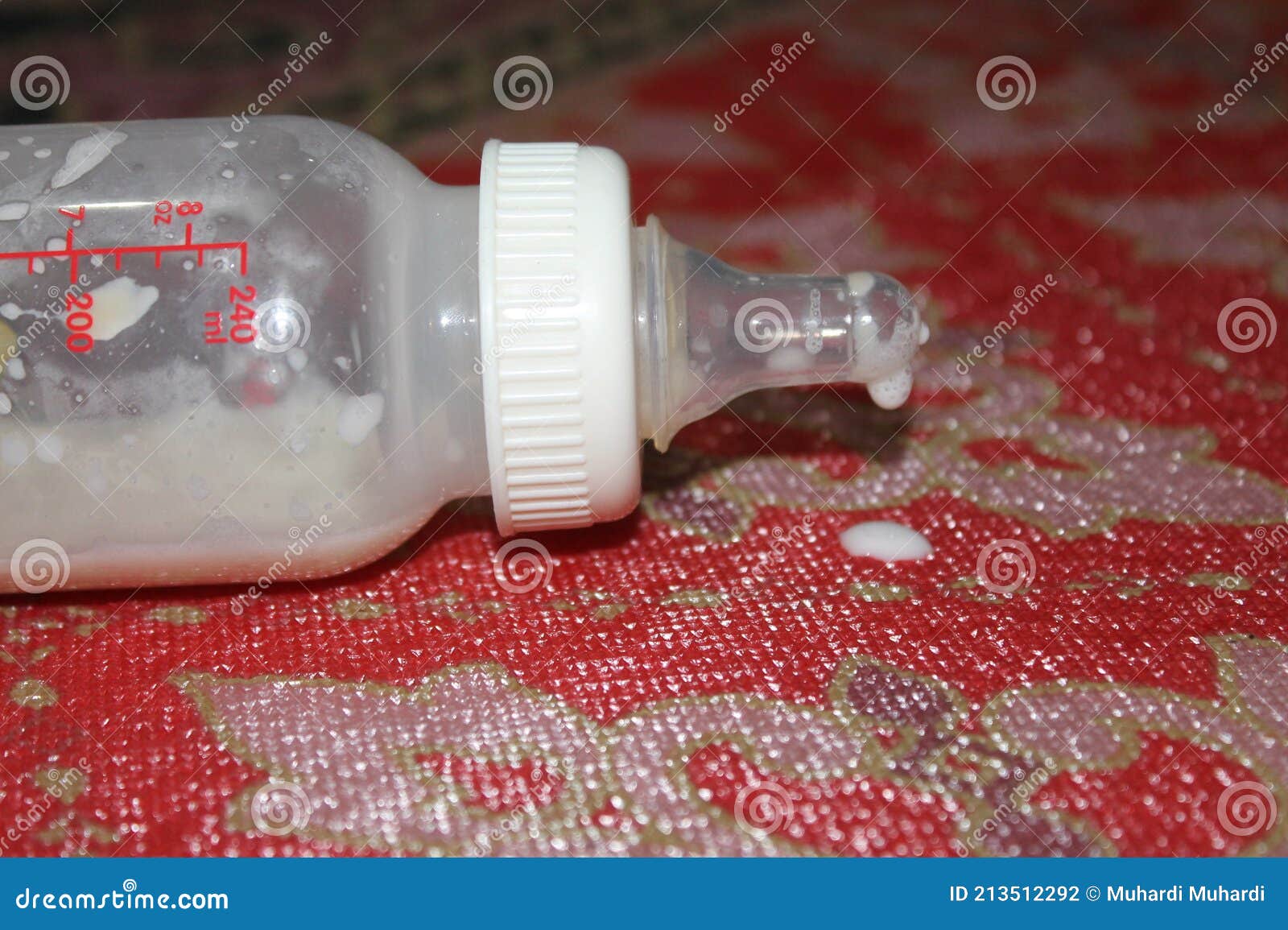 Baby Bottle Spilled on the Carpet Stock Photo Image of hand, carpet