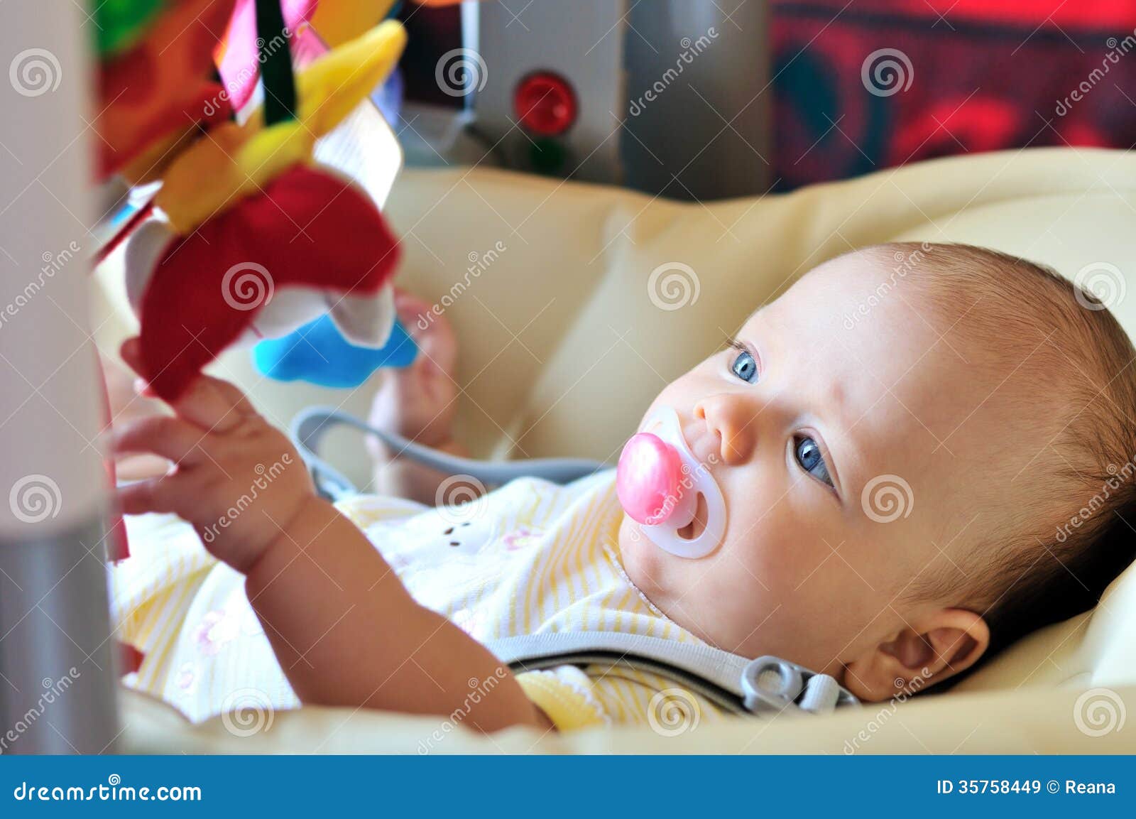 Baby in bouncer chair stock image. Image of month, happy 35758449