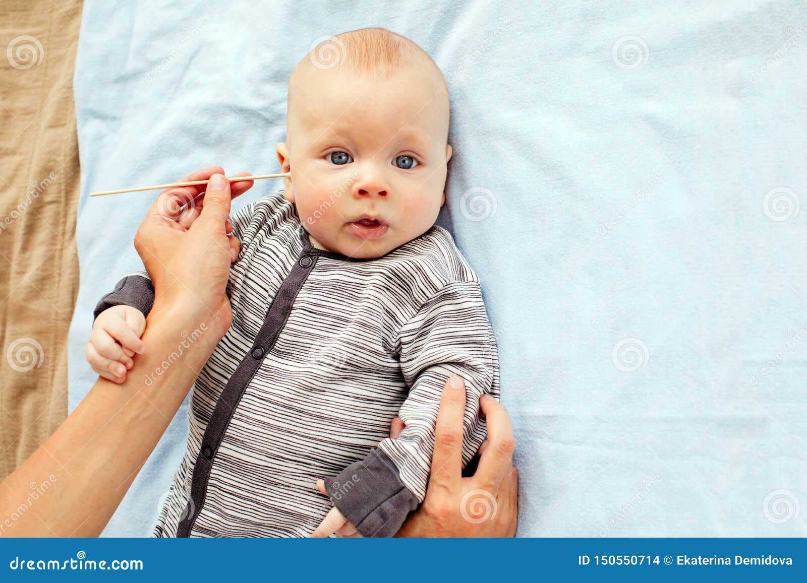 Baby boy cleaning ear stock photo. Image of newborn 150550714