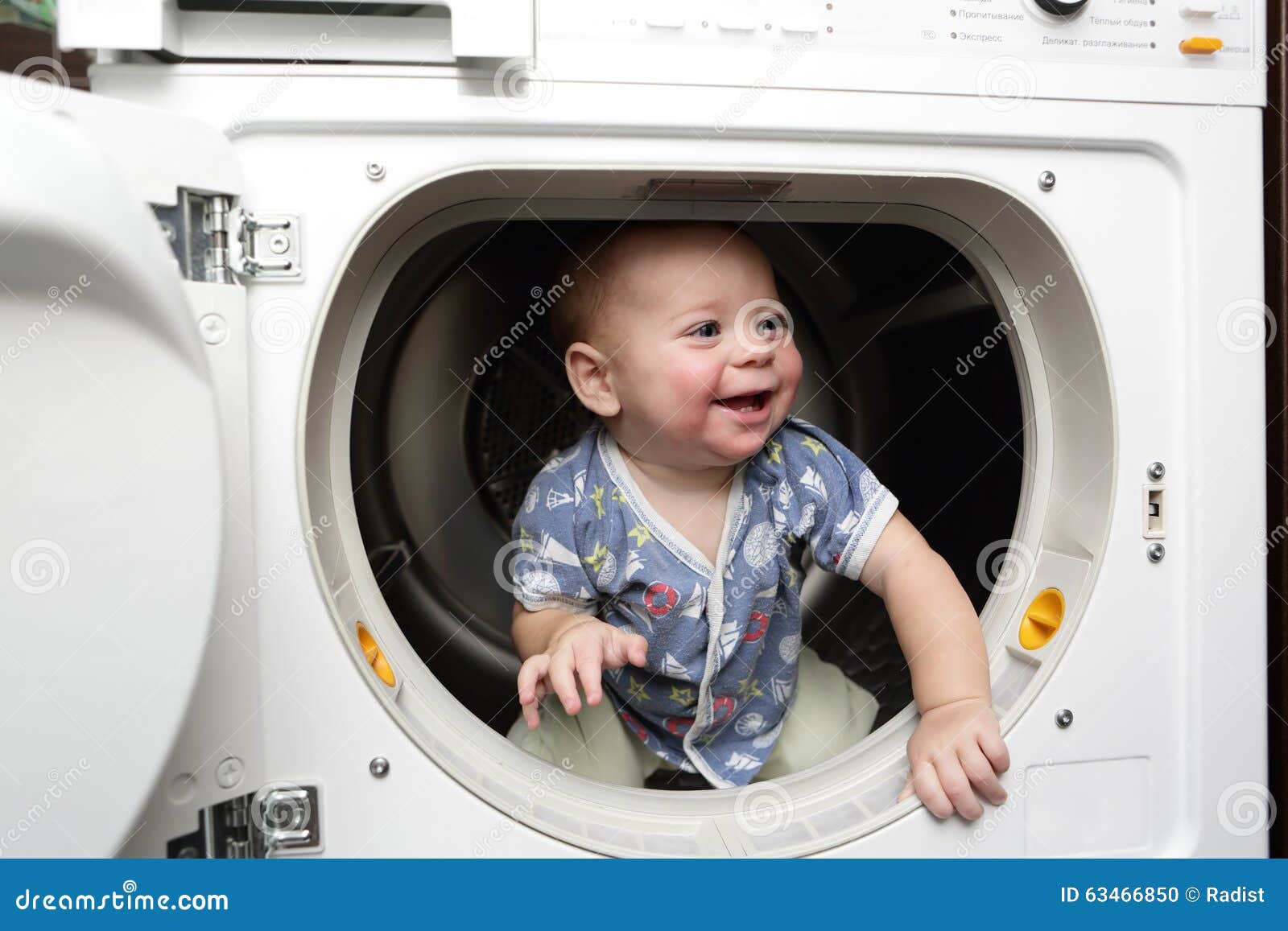 Baby boy in the dryer stock photo. Image of cleaning 63466850