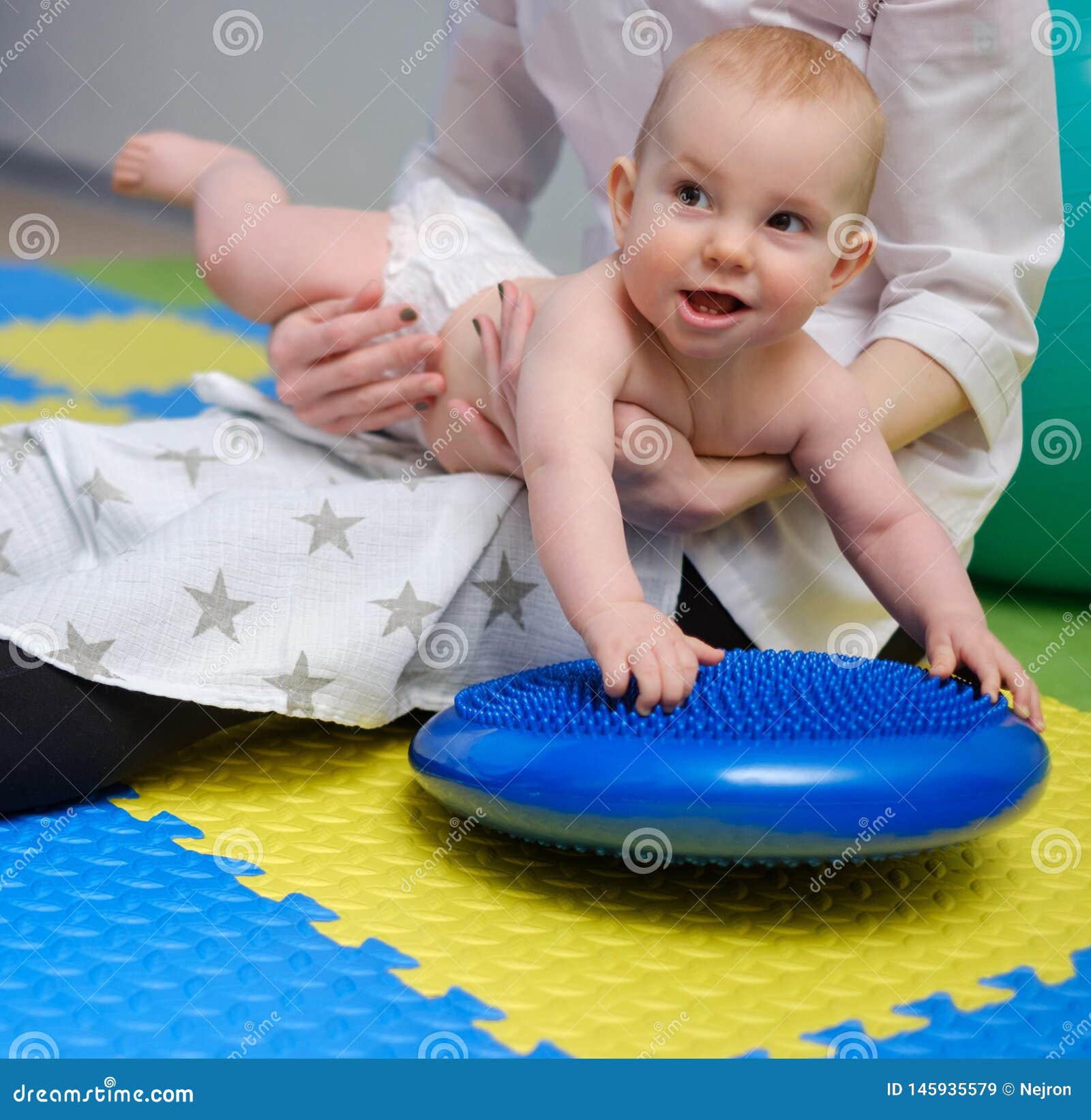 Baby Boy Getting Massage with Special Equipment Stock Image Image of