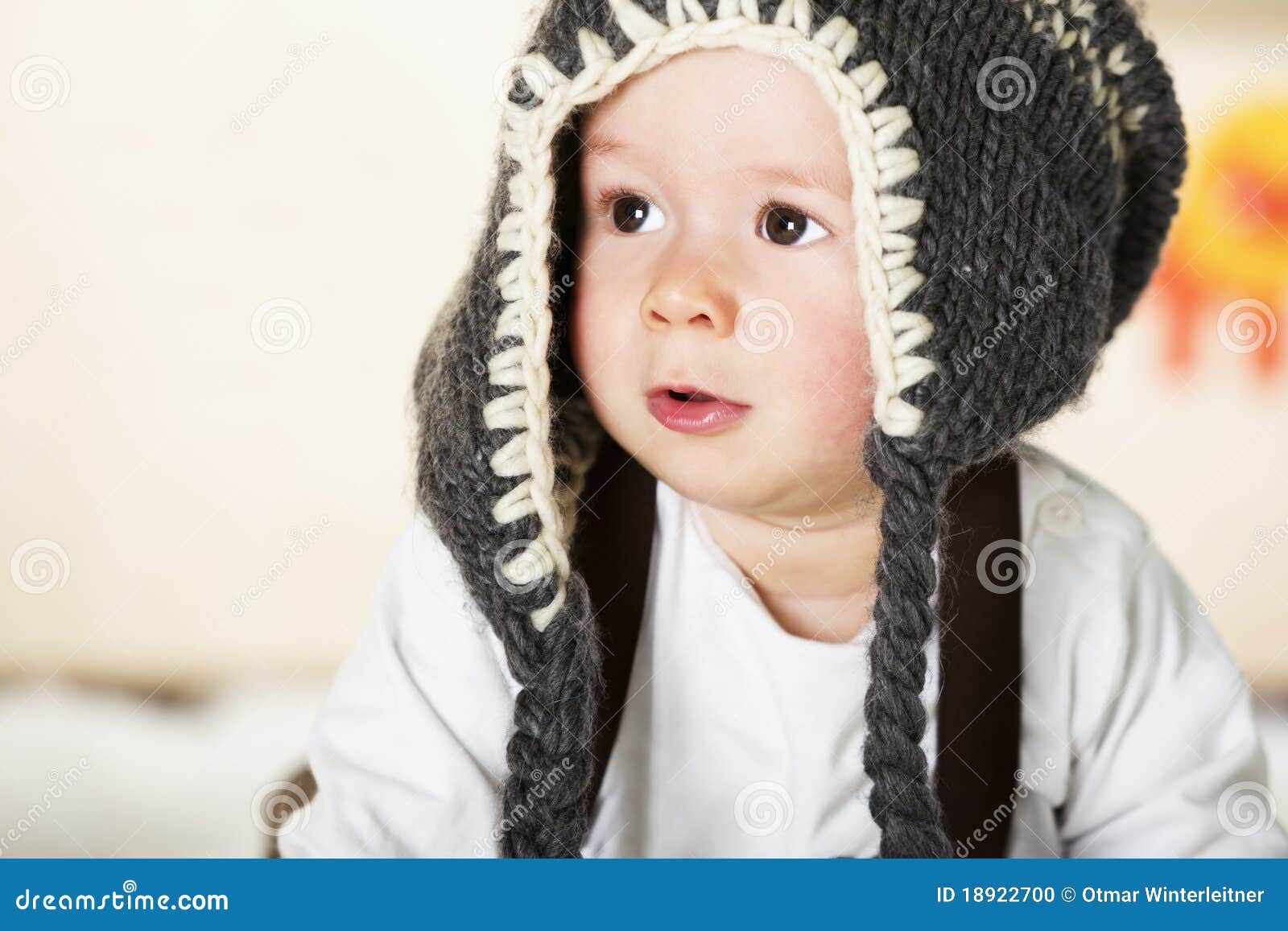 Baby Boy with Grey Cap Looking Innocently. Stock Photo Image of cute
