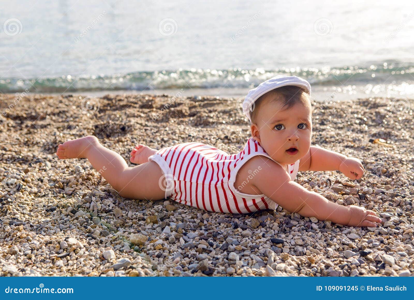 Baby Boy in Hat on Beach Pebbles Stock Image Image of child, ocean
