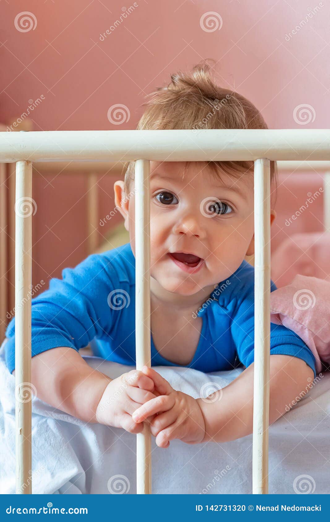 Baby boy in his crib stock photo. Image of infant, beautiful 142731320