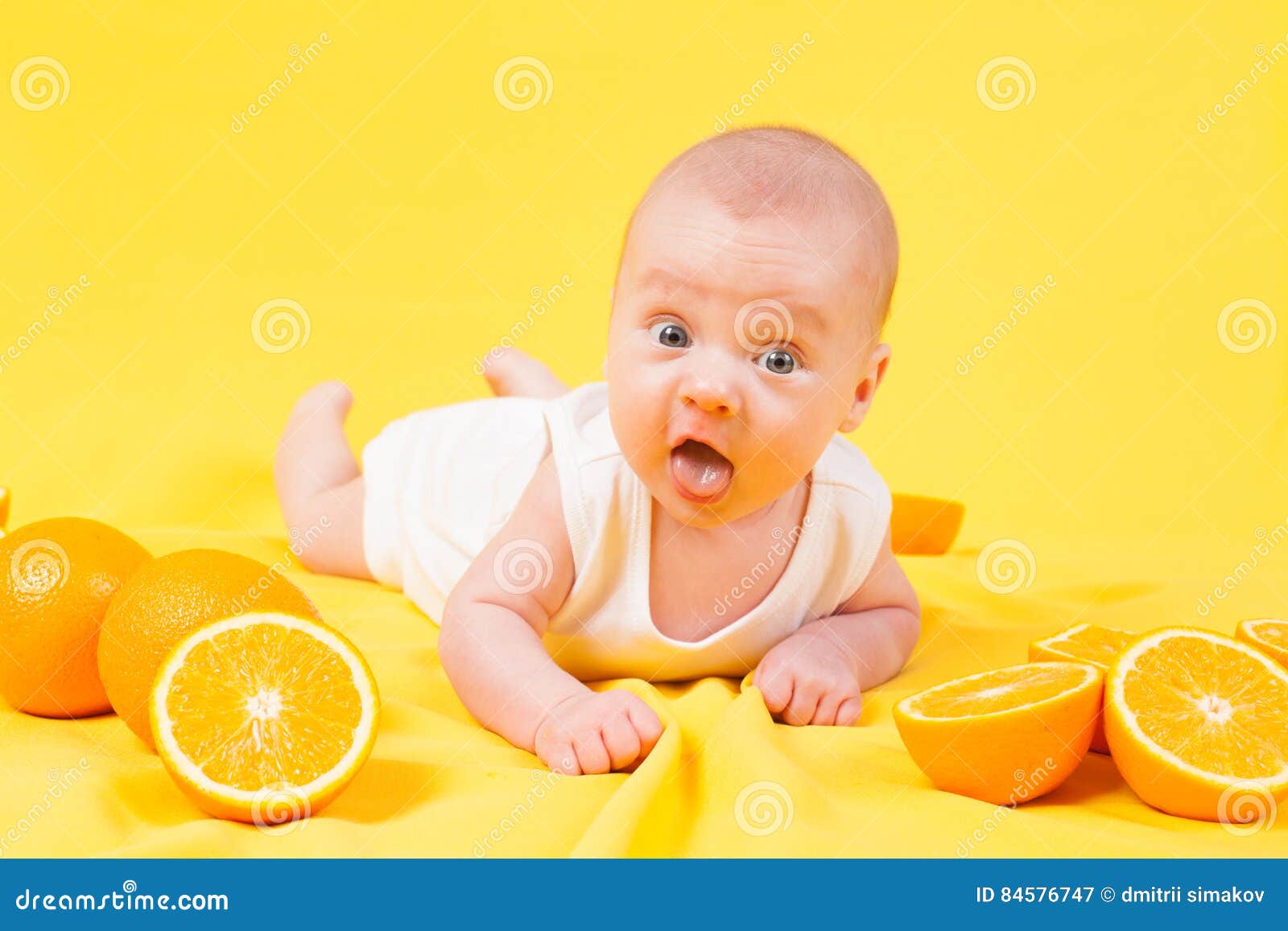 Baby Boy Lies on a Yellow with Oranges Stock Image Image of happy, newborn 84576747