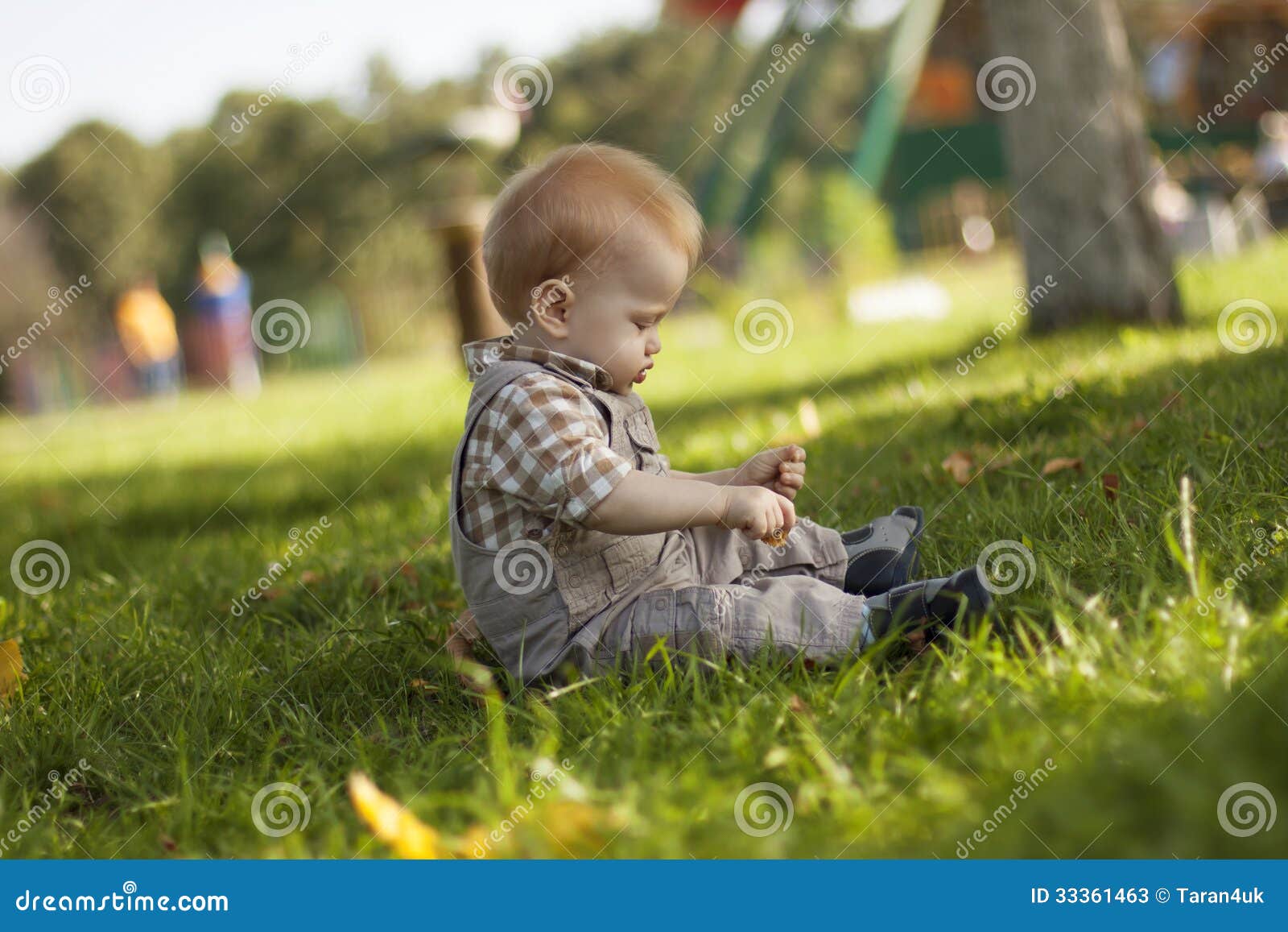 Baby boy playing outdoors stock image. Image of happy 33361463