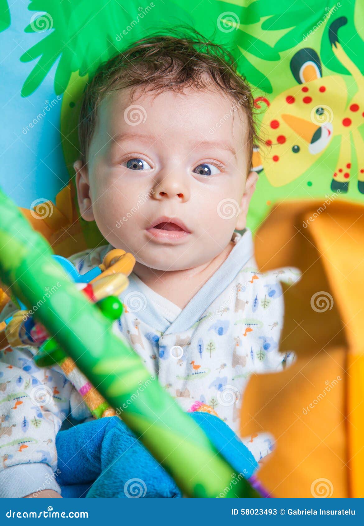 Baby boy on playmat stock image. Image of cute, colorful 58023493