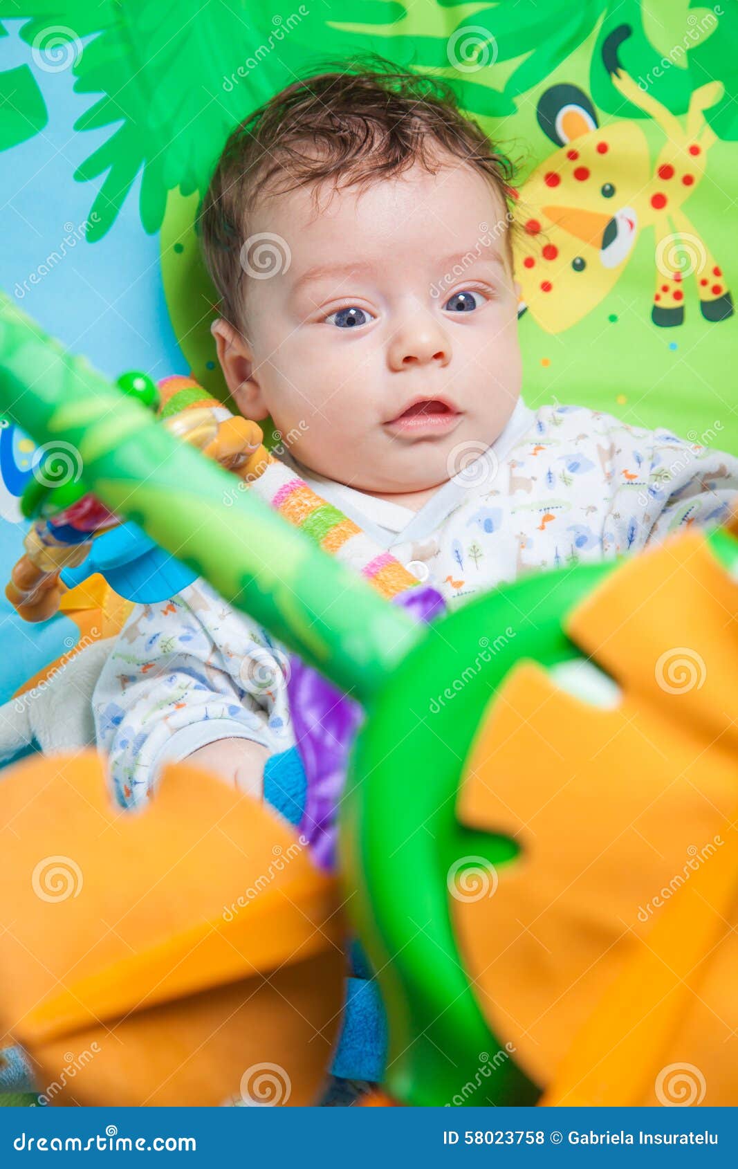 Baby boy on playmat stock photo. Image of expression 58023758