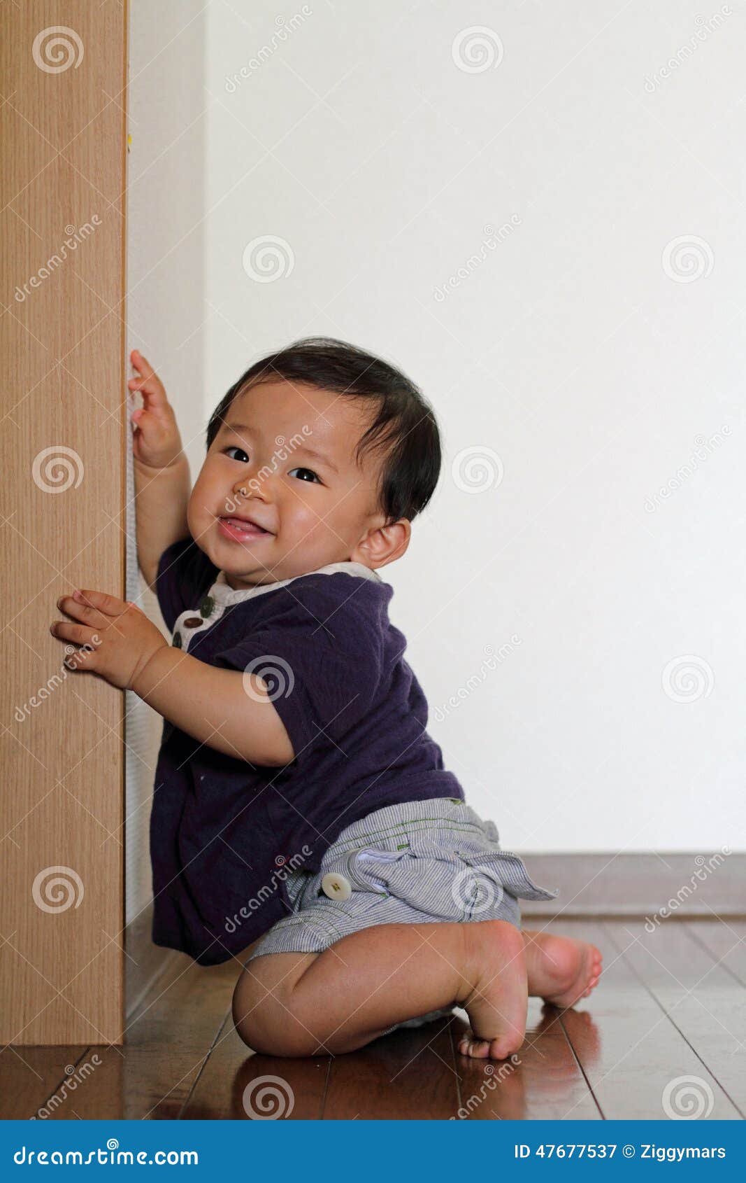 Baby Boy Pulling Up To Stand Stock Image Image of small, child 47677537