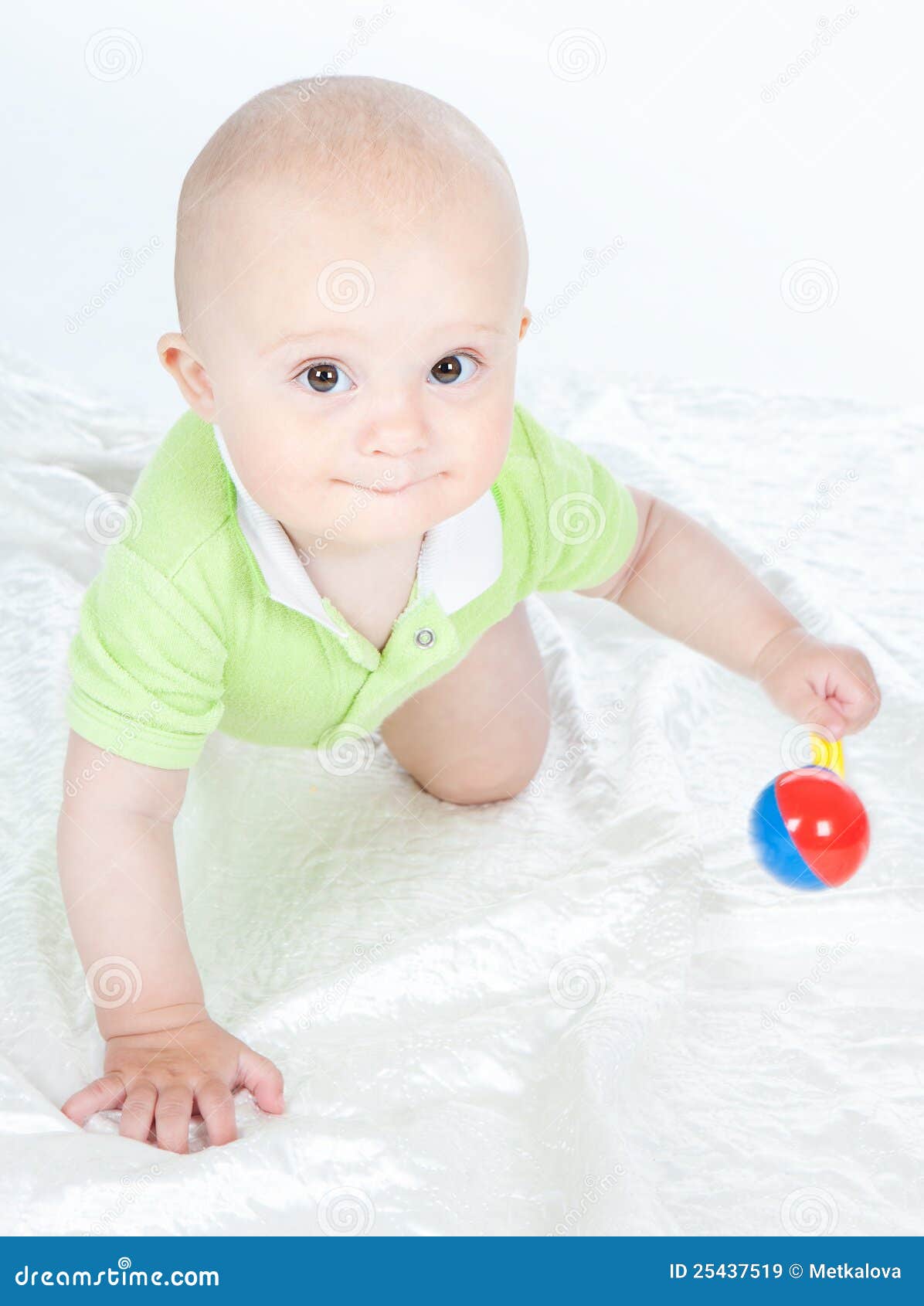Baby boy with a rattle stock image. Image of caucasian 25437519